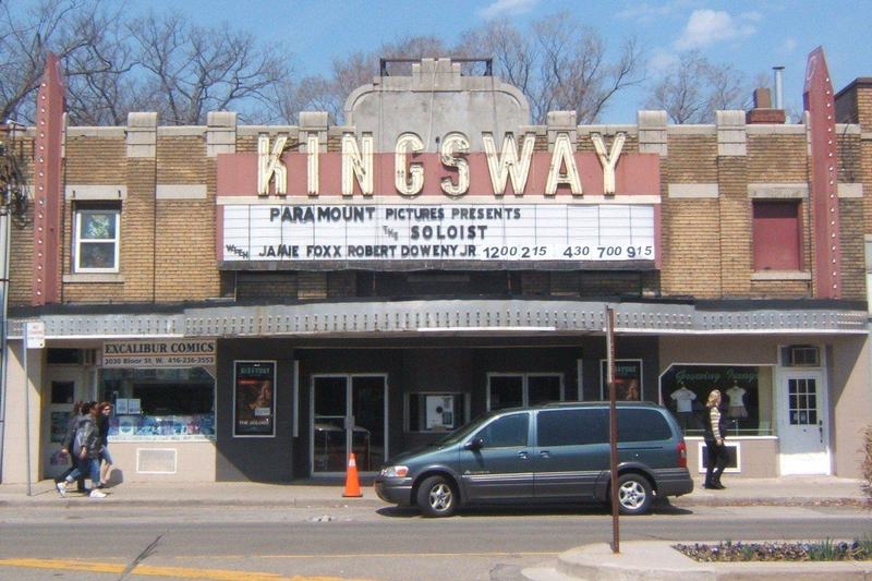 The Kingsway Theatre marquee on Bloor Street West in Etobicoke, with a brick facade and a van parked at the curb